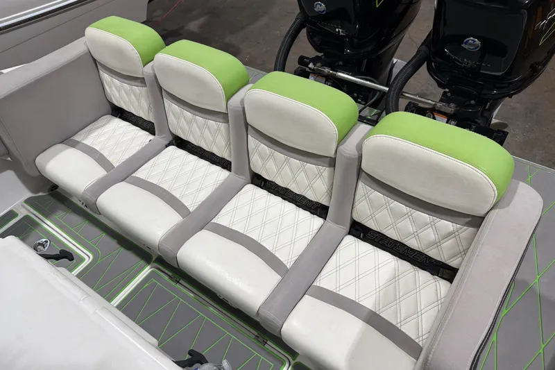  Yacht Photos Pics Four cushioned seats on a 2017 Statement 350 Open boat, featuring green and white upholstery.