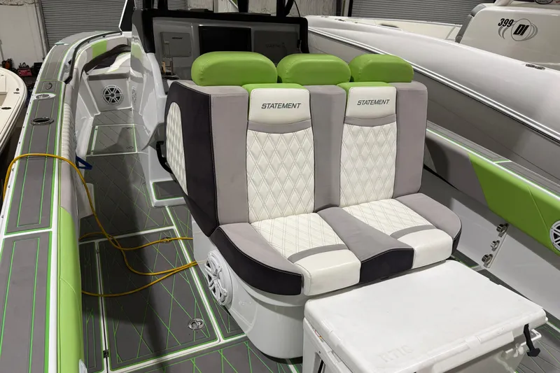  Yacht Photos Pics Luxury seating on 2017 Statement 350 Open boat with green accents and diamond stitching.
