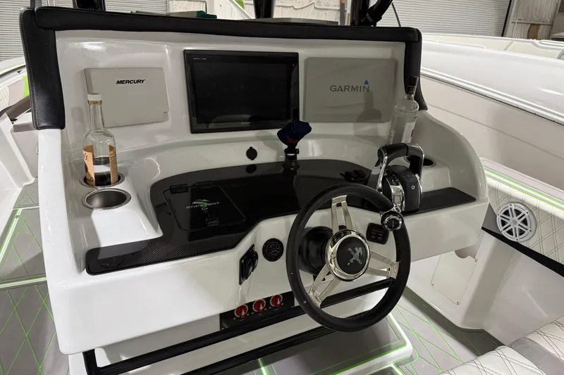  Yacht Photos Pics Helm of 2017 Statement 350 Open boat with Garmin and Mercury controls.