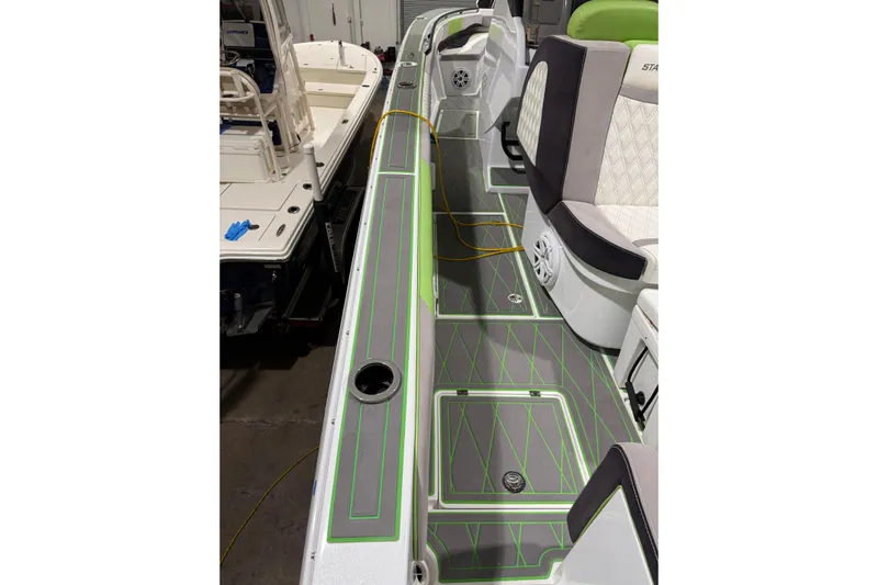  Yacht Photos Pics 2017 Statement 350 Open boat interior with gray and green flooring, cushioned seating.