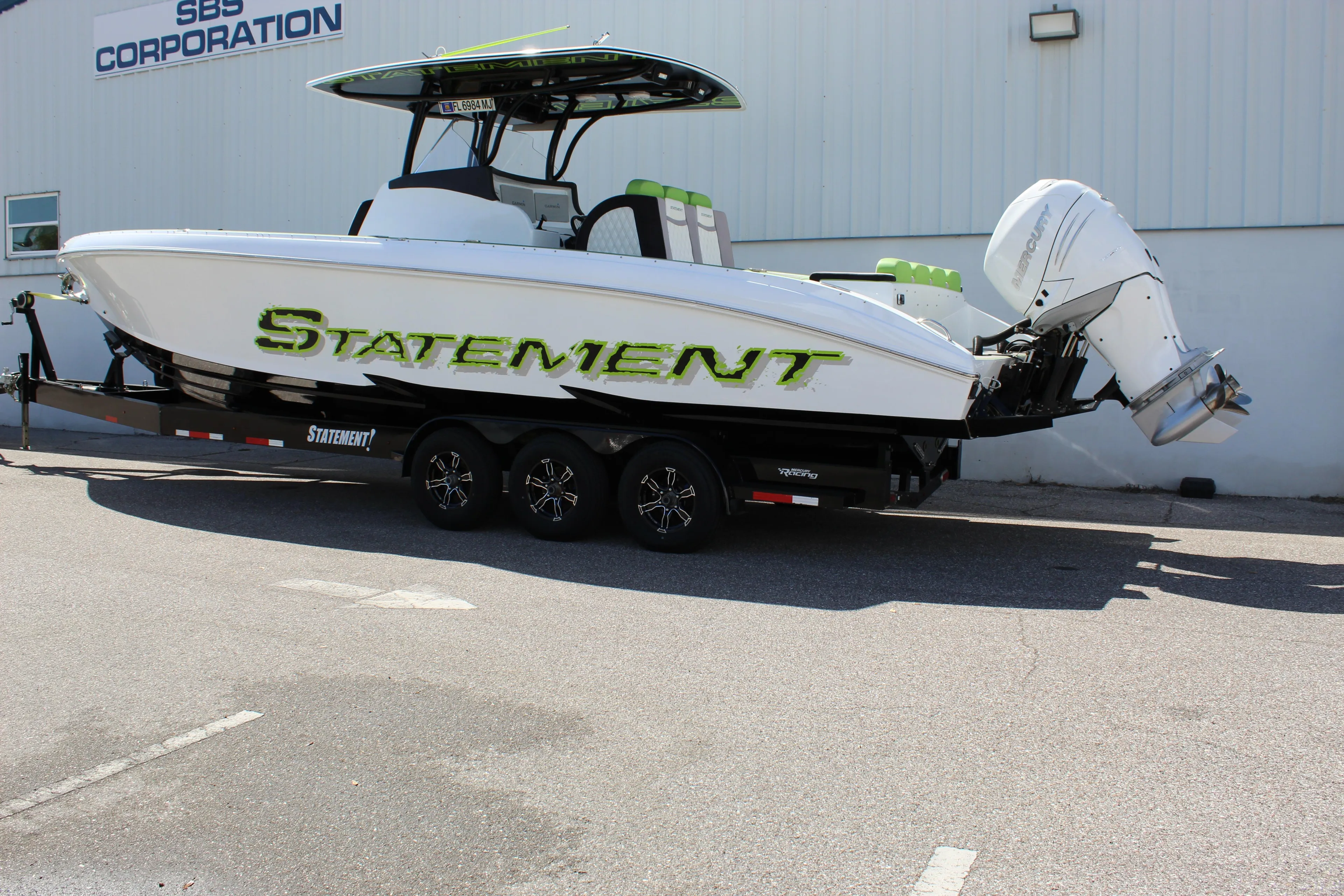 2017 Statement 350 Open boat on trailer, parked outside SBS Corporation building.