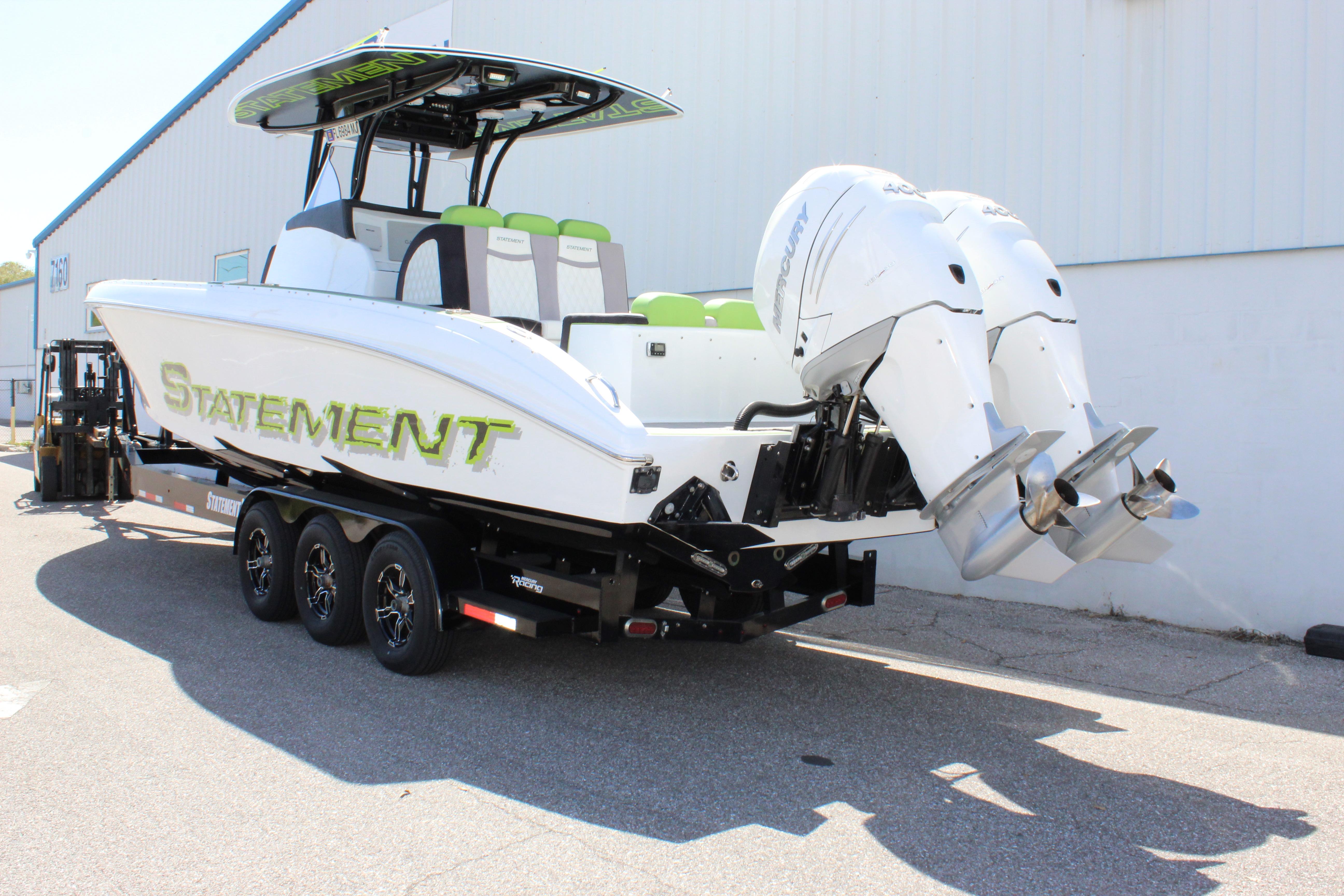 2017 Statement 350 Open boat on trailer with dual outboard engines.