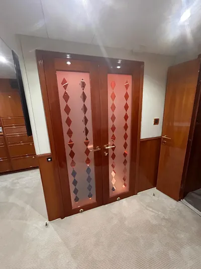 Sue Carolyn Yacht Photos Pics Luxurious interior of 2003 Hargrave Sky Lounge yacht with elegant wooden doors.