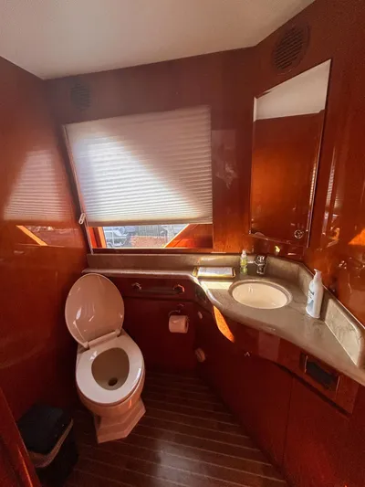 Sue Carolyn Yacht Photos Pics Luxurious bathroom in 2003 Hargrave Sky Lounge yacht with wood paneling and modern fixtures.