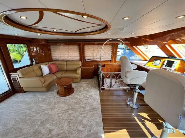 Sue Carolyn Yacht Photos Pics Luxurious interior of 2003 Hargrave Sky Lounge yacht with plush seating and elegant wood finishes.