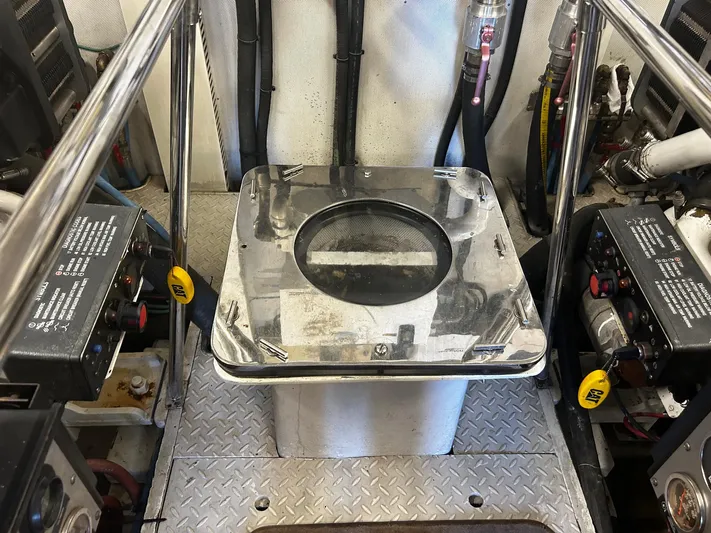 Sue Carolyn Yacht Photos Pics Engine room of 2003 Hargrave Sky Lounge yacht with machinery and control panels.