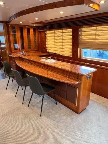 Sue Carolyn Yacht Photos Pics Luxurious 2003 Hargrave Sky Lounge interior with elegant wood finishes and modern seating.