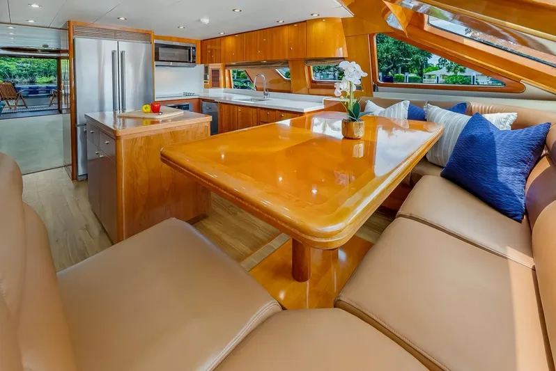 Sue Carolyn Yacht Photos Pics Luxurious 2003 Hargrave Sky Lounge interior with elegant dining area and modern kitchen.