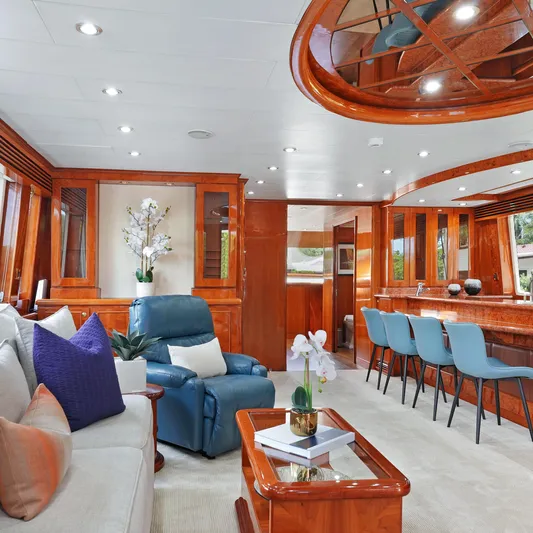Sue Carolyn Yacht Photos Pics Luxurious interior of 2003 Hargrave Sky Lounge yacht with elegant seating and wooden finishes.
