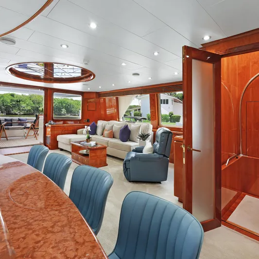Sue Carolyn Yacht Photos Pics Luxurious interior of 2003 Hargrave Sky Lounge yacht with elegant seating and wood finishes.