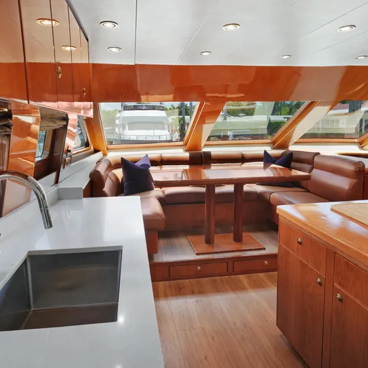 Sue Carolyn Yacht Photos Pics Luxurious 2003 Hargrave Sky Lounge interior with elegant wood finishes and spacious seating area.