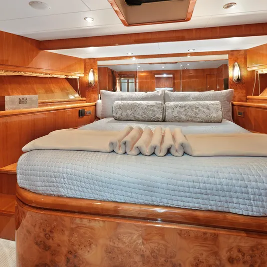 Sue Carolyn Yacht Photos Pics Luxurious bedroom interior of 2003 Hargrave Sky Lounge yacht with elegant wood finishes.