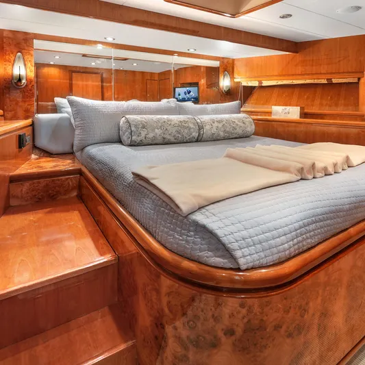 Sue Carolyn Yacht Photos Pics Luxurious bedroom interior on 2003 Hargrave Sky Lounge yacht with elegant wood finishes.