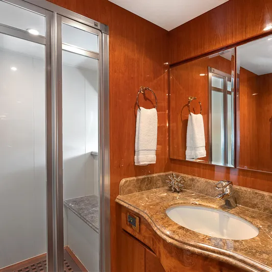 Sue Carolyn Yacht Photos Pics Luxurious bathroom in 2003 Hargrave Sky Lounge yacht with marble countertop and shower.