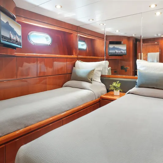 Sue Carolyn Yacht Photos Pics Luxurious 2003 Hargrave Sky Lounge yacht cabin with twin beds and elegant wood paneling.