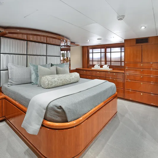 Sue Carolyn Yacht Photos Pics Luxurious bedroom interior on 2003 Hargrave Sky Lounge yacht with elegant wood finishes.