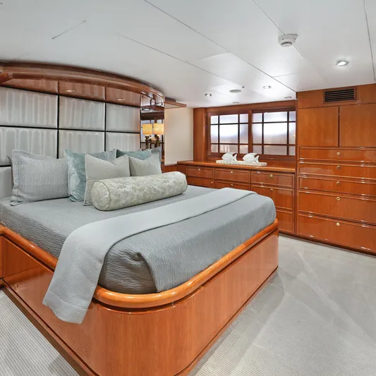 Sue Carolyn Yacht Photos Pics Luxurious bedroom interior on 2003 Hargrave Sky Lounge yacht with elegant wood finishes.