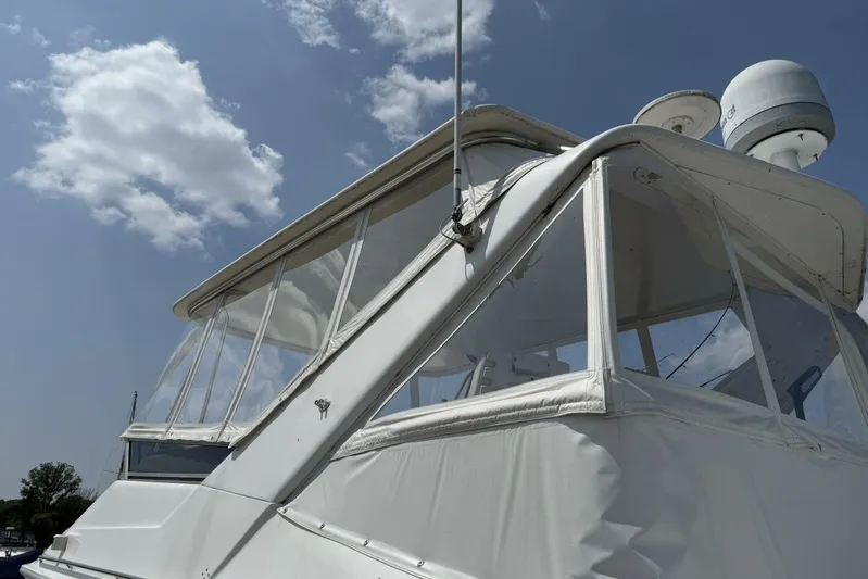  Yacht Photos Pics 1995 Sea Ray 550 Sedan Bridge yacht under a clear blue sky.