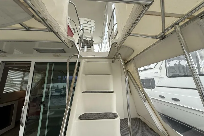 Yacht Photos Pics Interior view of 1995 Sea Ray 550 Sedan Bridge yacht with stairs and windows.