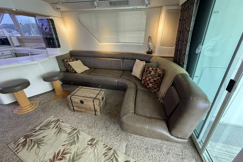  Yacht Photos Pics Luxurious 1995 Sea Ray 550 Sedan Bridge interior with leather seating and modern decor.