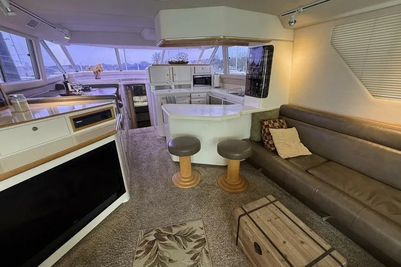  Yacht Photos Pics Luxurious interior of a 1995 Sea Ray 550 Sedan Bridge yacht with modern amenities.