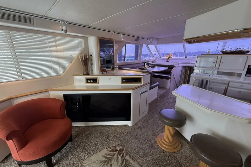  Yacht Photos Pics Luxurious interior of a 1995 Sea Ray 550 Sedan Bridge yacht with modern amenities.