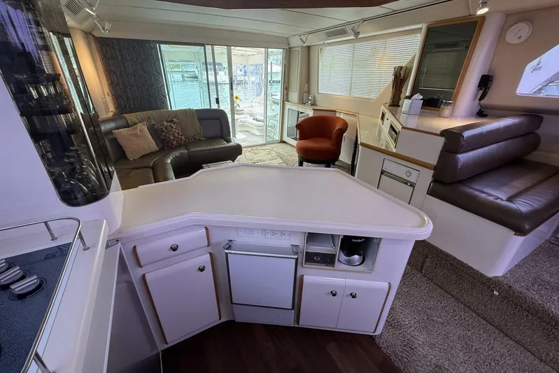  Yacht Photos Pics Luxurious interior of a 1995 Sea Ray 550 Sedan Bridge yacht with modern furnishings.