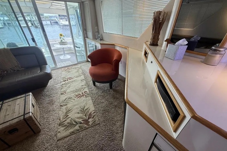  Yacht Photos Pics Luxurious interior of 1995 Sea Ray 550 Sedan Bridge yacht with cozy seating and elegant decor.