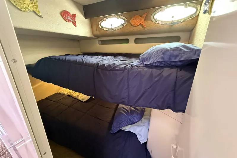  Yacht Photos Pics Bunk beds in 1995 Sea Ray 550 Sedan Bridge cabin with nautical decor.