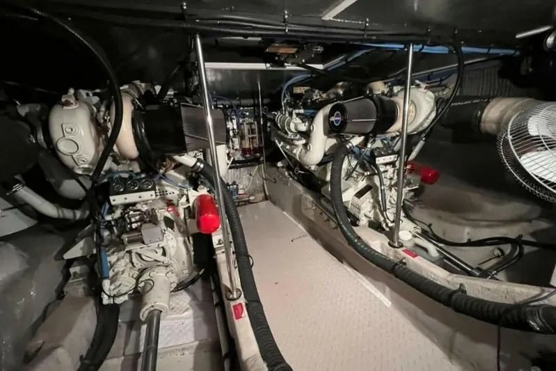  Yacht Photos Pics Engine room of 1995 Sea Ray 550 Sedan Bridge with dual engines and mechanical components.