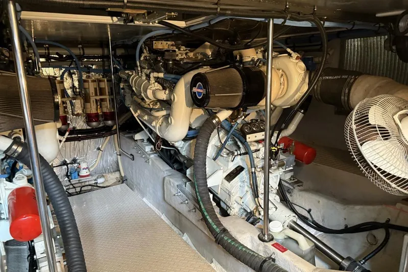  Yacht Photos Pics Engine room of a 1995 Sea Ray 550 Sedan Bridge yacht, showcasing mechanical components.