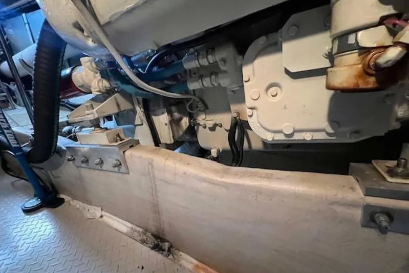  Yacht Photos Pics Engine compartment of a 1995 Sea Ray 550 Sedan Bridge yacht, showcasing mechanical components.