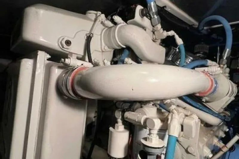  Yacht Photos Pics Engine components of a 1995 Sea Ray 550 Sedan Bridge yacht, featuring pipes and connectors.