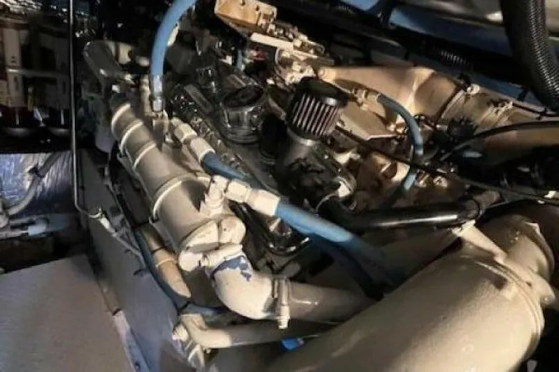  Yacht Photos Pics Engine compartment of a 1995 Sea Ray 550 Sedan Bridge with visible pipes and components.