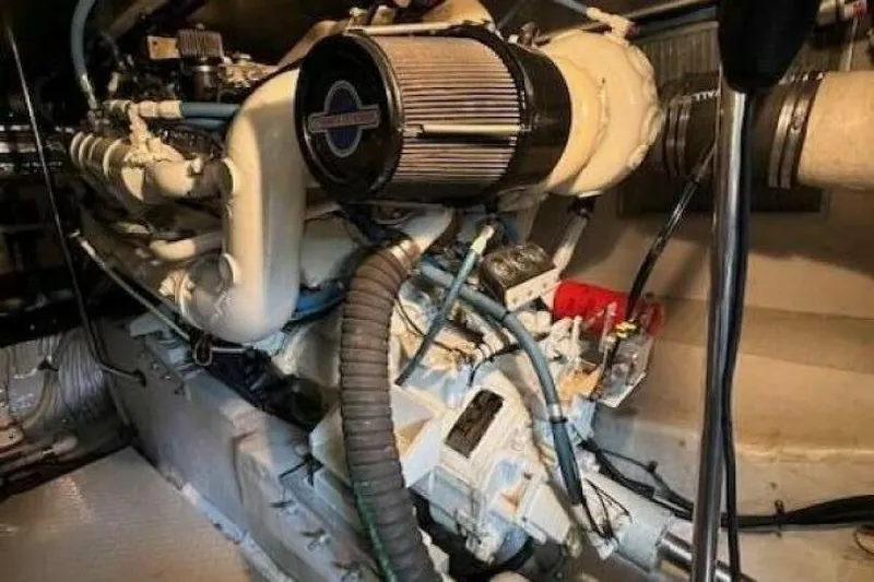  Yacht Photos Pics Engine room of a 1995 Sea Ray 550 Sedan Bridge yacht, showcasing mechanical components.