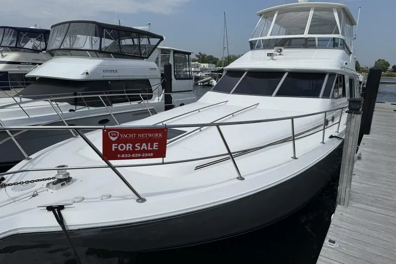  Yacht Photos Pics 1995 Sea Ray 550 Sedan Bridge yacht for sale at marina dock.