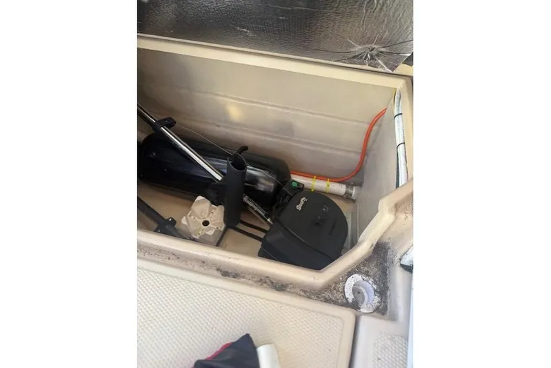  Yacht Photos Pics Storage compartment of a 2016 Cutwater 28 boat with equipment and wiring.