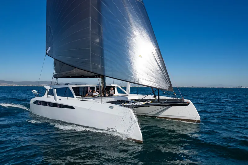 Yacht Photos Pics 2025 Ocean Renegade R6 catamaran sailing on open water.