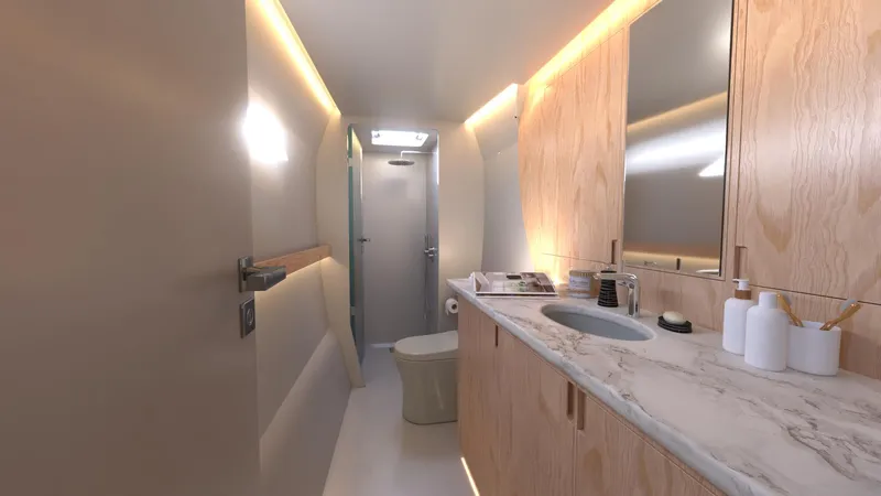  Yacht Photos Pics Modern bathroom in 2025 Ocean Renegade R6 yacht with marble countertop and wooden cabinets.