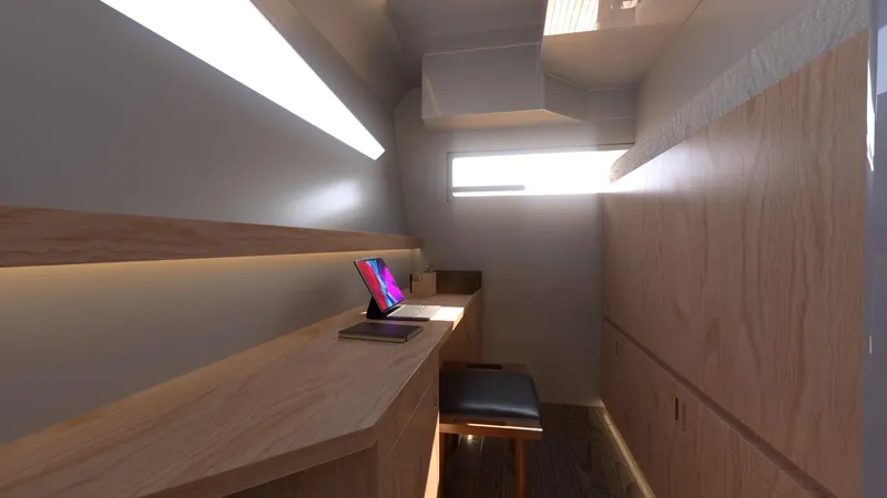  Yacht Photos Pics Modern workspace inside Ocean Renegade R6 yacht, 2025 model, featuring wooden desk and natural lighting.