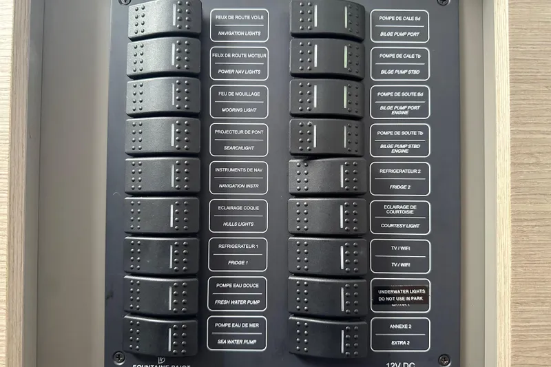 Maho Yacht Photos Pics Control panel of a 2021 Fountaine Pajot Astrea 42 Catamaran with labeled switches.