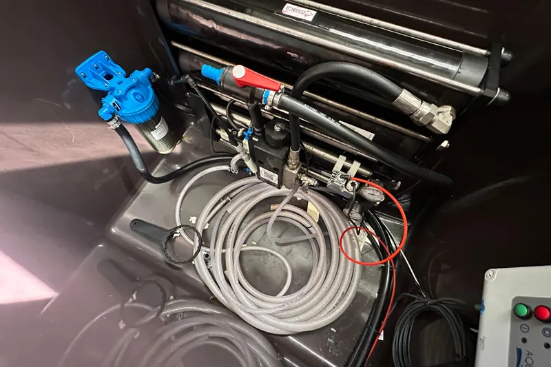 Maho Yacht Photos Pics Engine compartment of 2021 Fountaine Pajot Astrea 42 Catamaran with hoses and components.