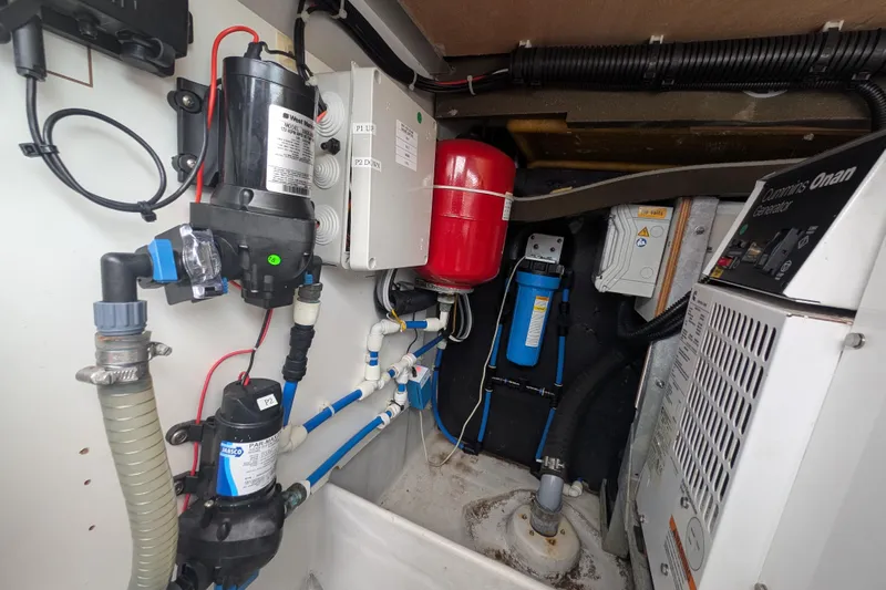 Maho Yacht Photos Pics Engine room of 2021 Fountaine Pajot Astrea 42 Catamaran with generator and plumbing systems.