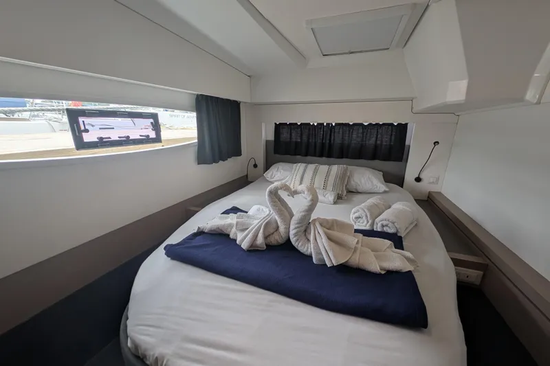 Maho Yacht Photos Pics Luxurious cabin interior of 2021 Fountaine Pajot Astrea 42 Catamaran with elegant bedding.