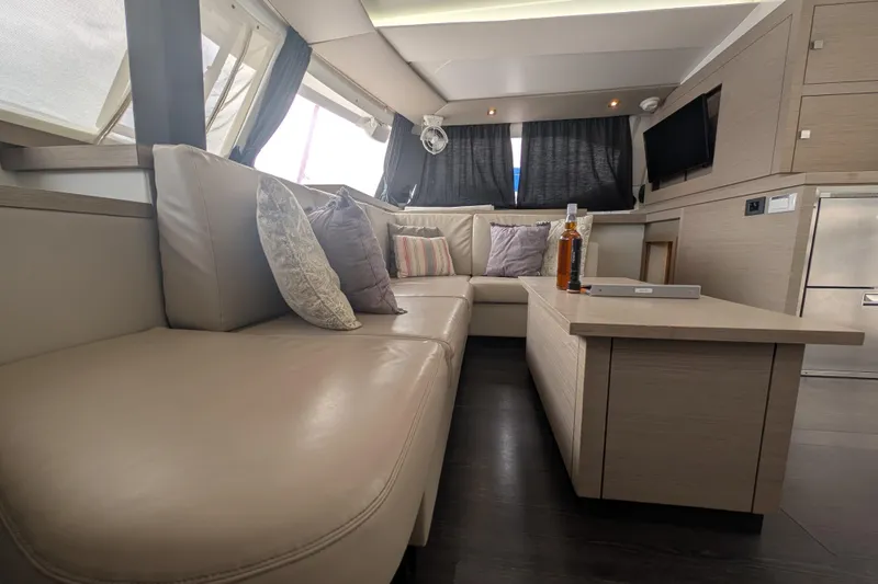 Maho Yacht Photos Pics Luxurious interior of 2021 Fountaine Pajot Astrea 42 Catamaran with plush seating and modern decor.