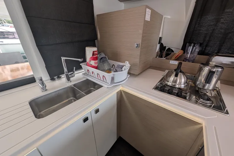 Maho Yacht Photos Pics Modern kitchen in 2021 Fountaine Pajot Astrea 42 Catamaran with sink and stove.