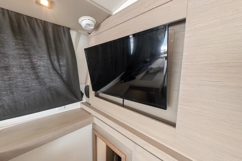 Maho Yacht Photos Pics Flat-screen TV in 2021 Fountaine Pajot Astrea 42 Catamaran interior, modern wood finish.