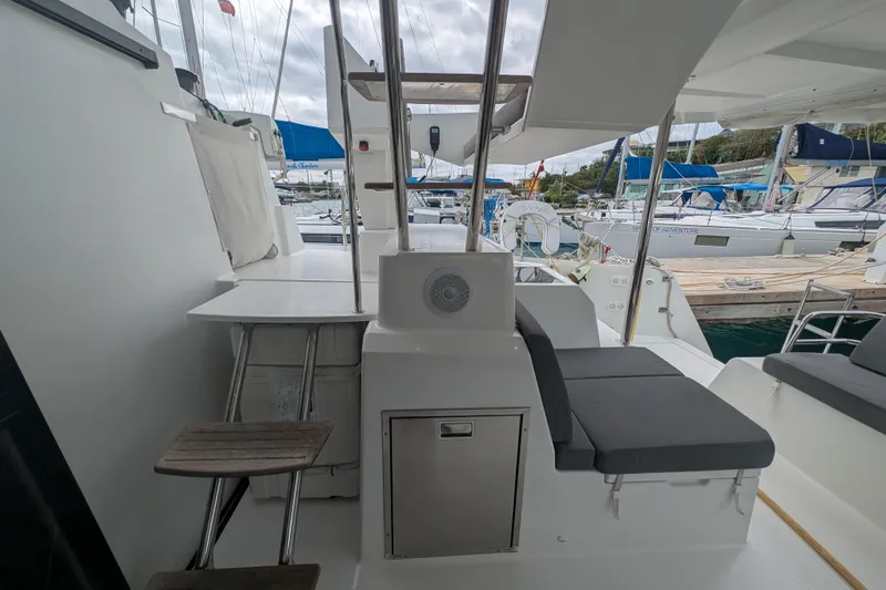 Maho Yacht Photos Pics 2021 Fountaine Pajot Astrea 42 Catamaran deck with seating and marina view.