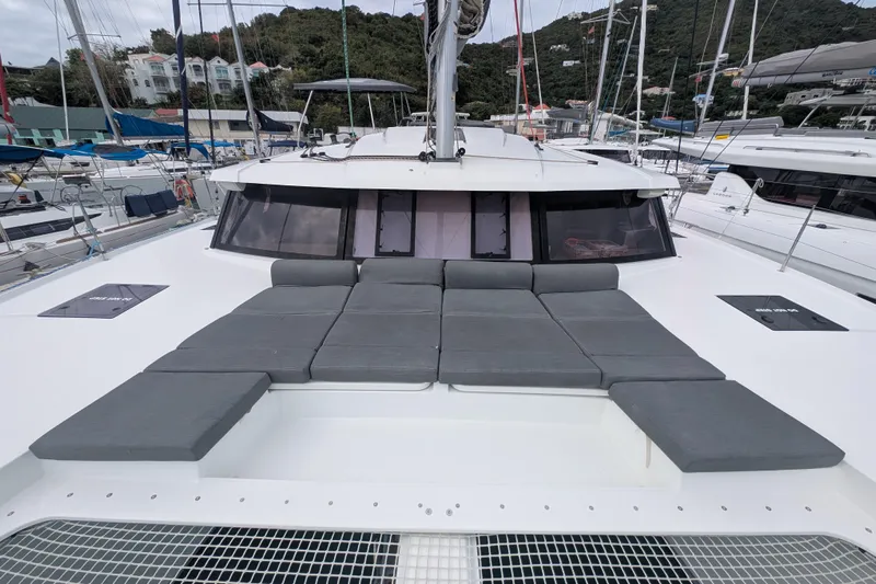 Maho Yacht Photos Pics 2021 Fountaine Pajot Astrea 42 Catamaran with spacious deck and cushioned seating.