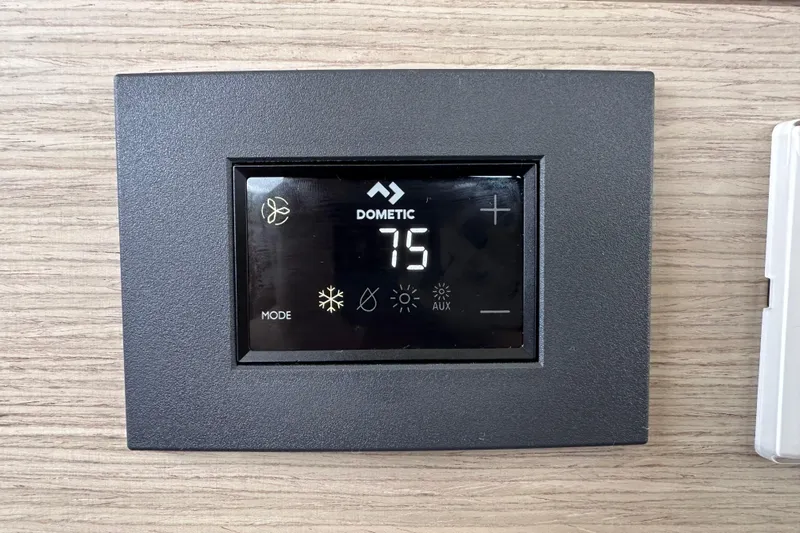 Maho Yacht Photos Pics Dometic thermostat on 2021 Fountaine Pajot Astrea 42 Catamaran, set to 75 degrees.